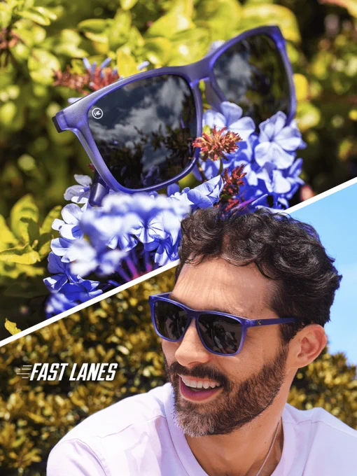 Sunglasses are positioned among vibrant blue flowers, reflecting clear skies. Below, an individual wearing similar sunglasses smiles with greenery in the background. The text "FAST LANES" appears on the lower segment.
